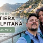 Coppia sul traghetto verso la Costiera Amalfitana senza auto con vista su Positano